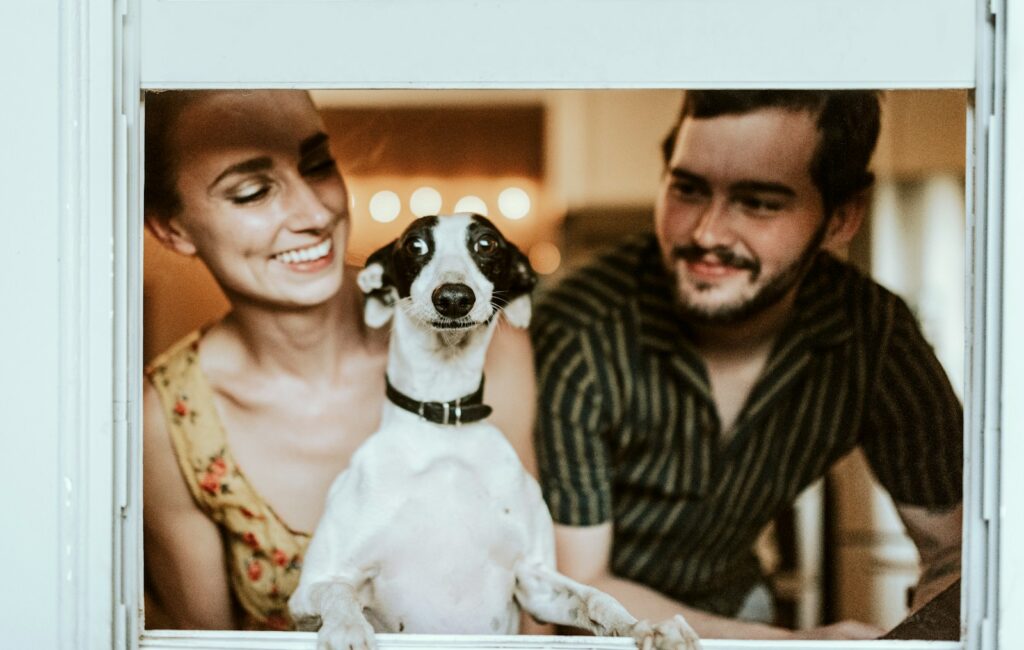 man in black and white striped shirt beside woman in black and white stripe shirt